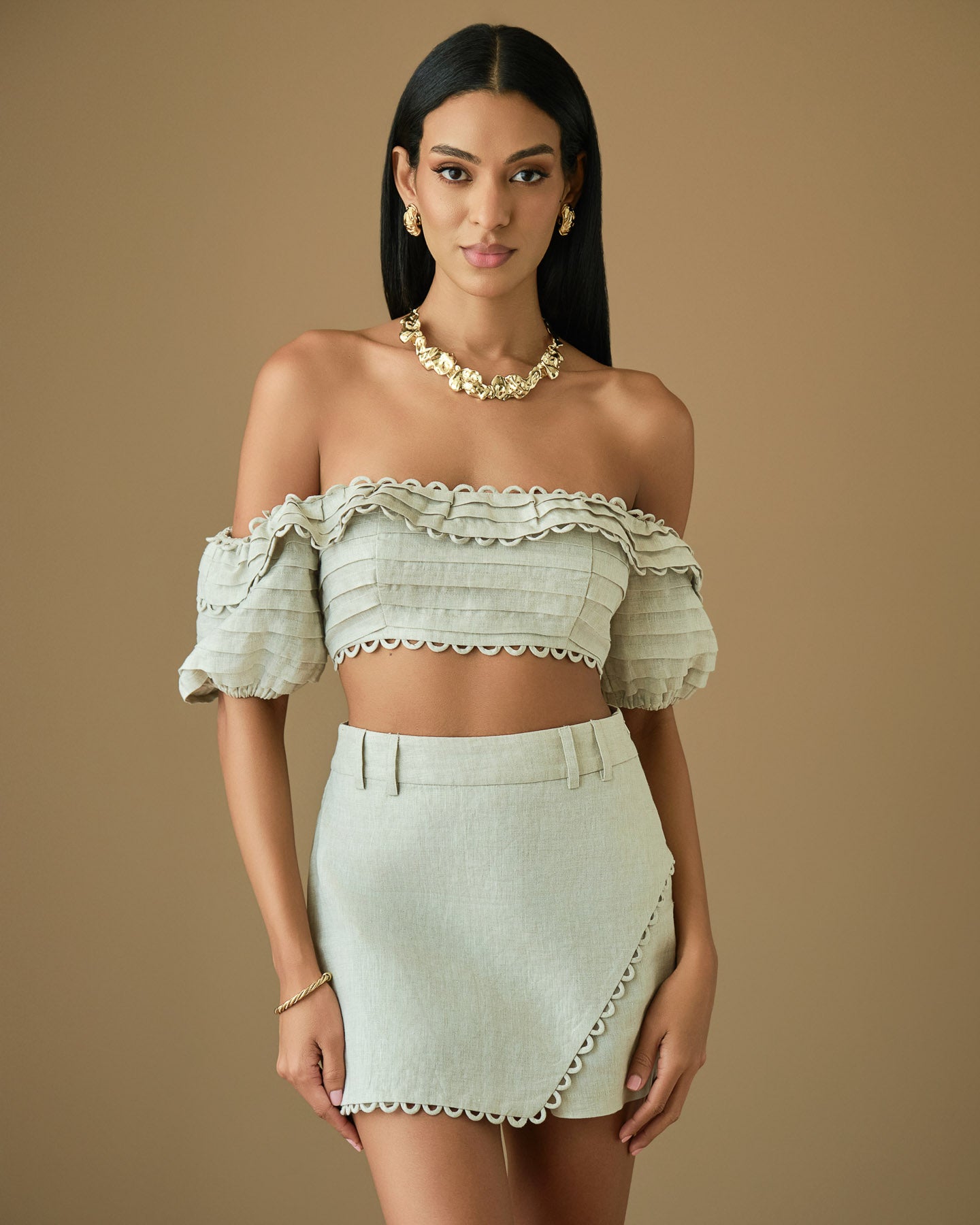 Beige linen crop top and wrap skort set with feminine silhouette
