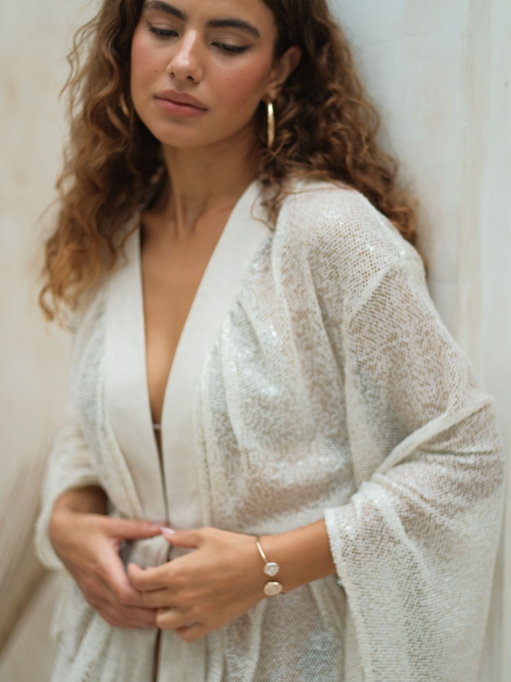 Elegant cream sequin beach cover-up designed for relaxed, elevated resort dressing