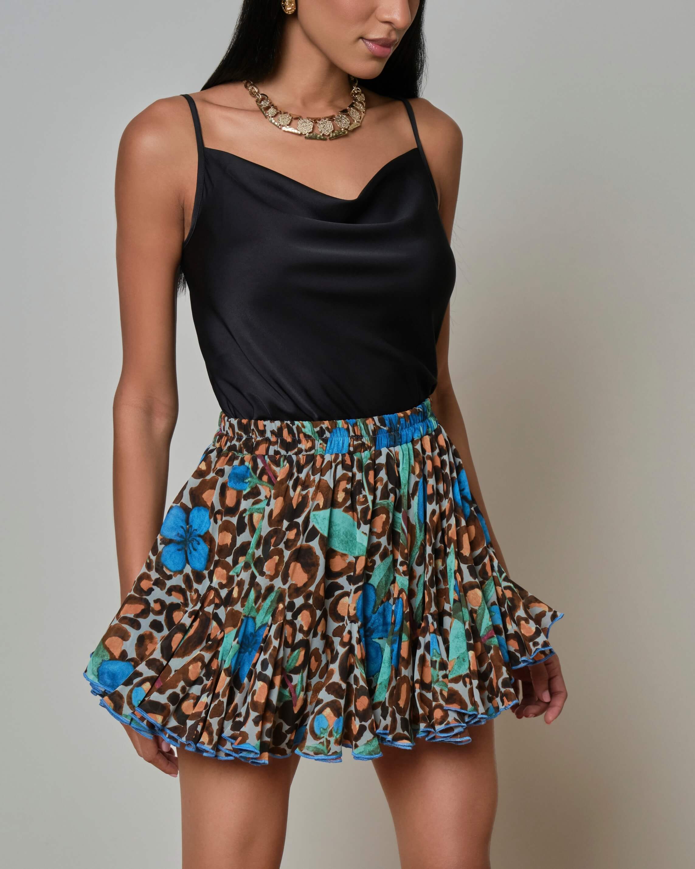 Leopard print mini skirt with blue and green accents