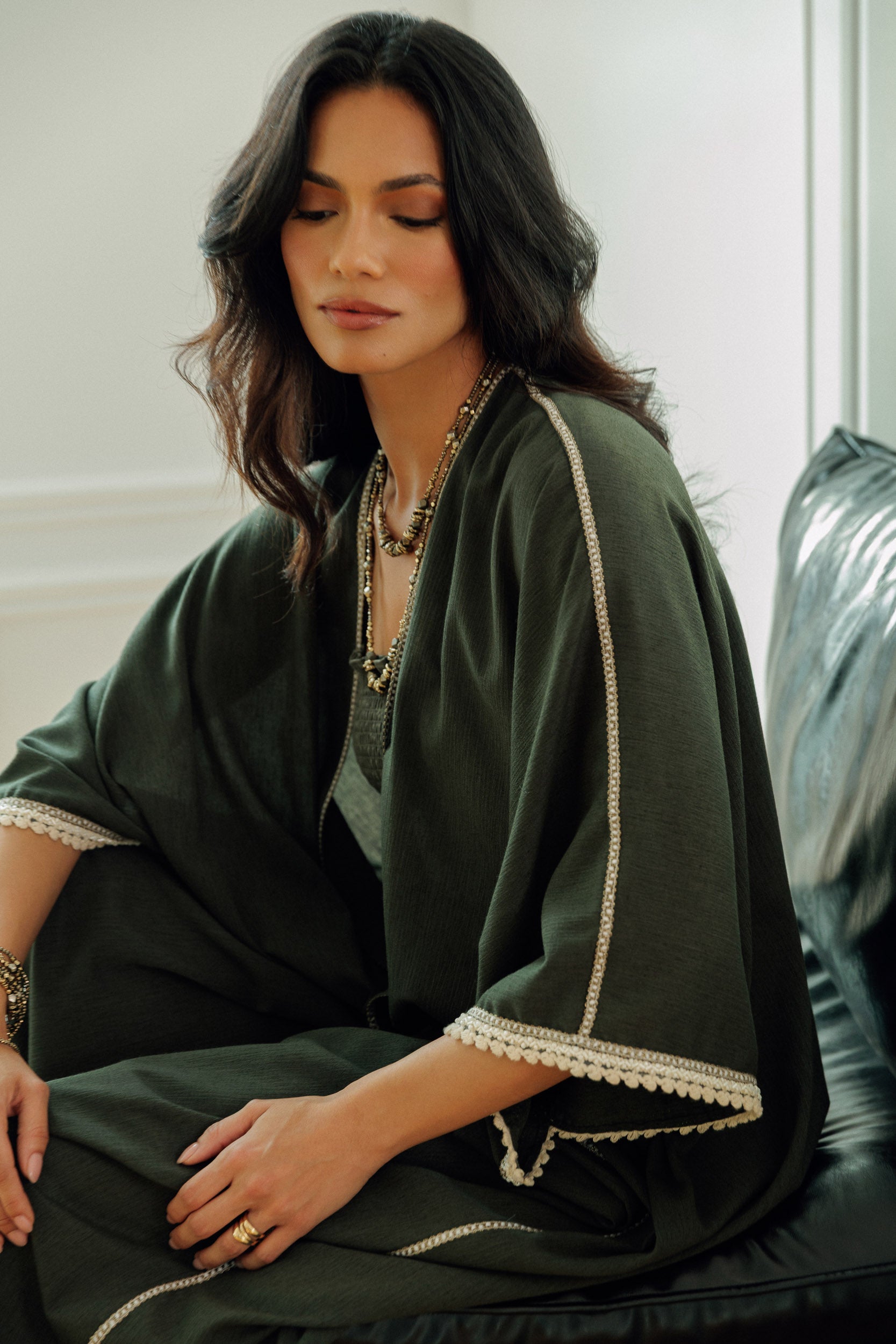 Olive green Nellie kaftan styled over a matching dress