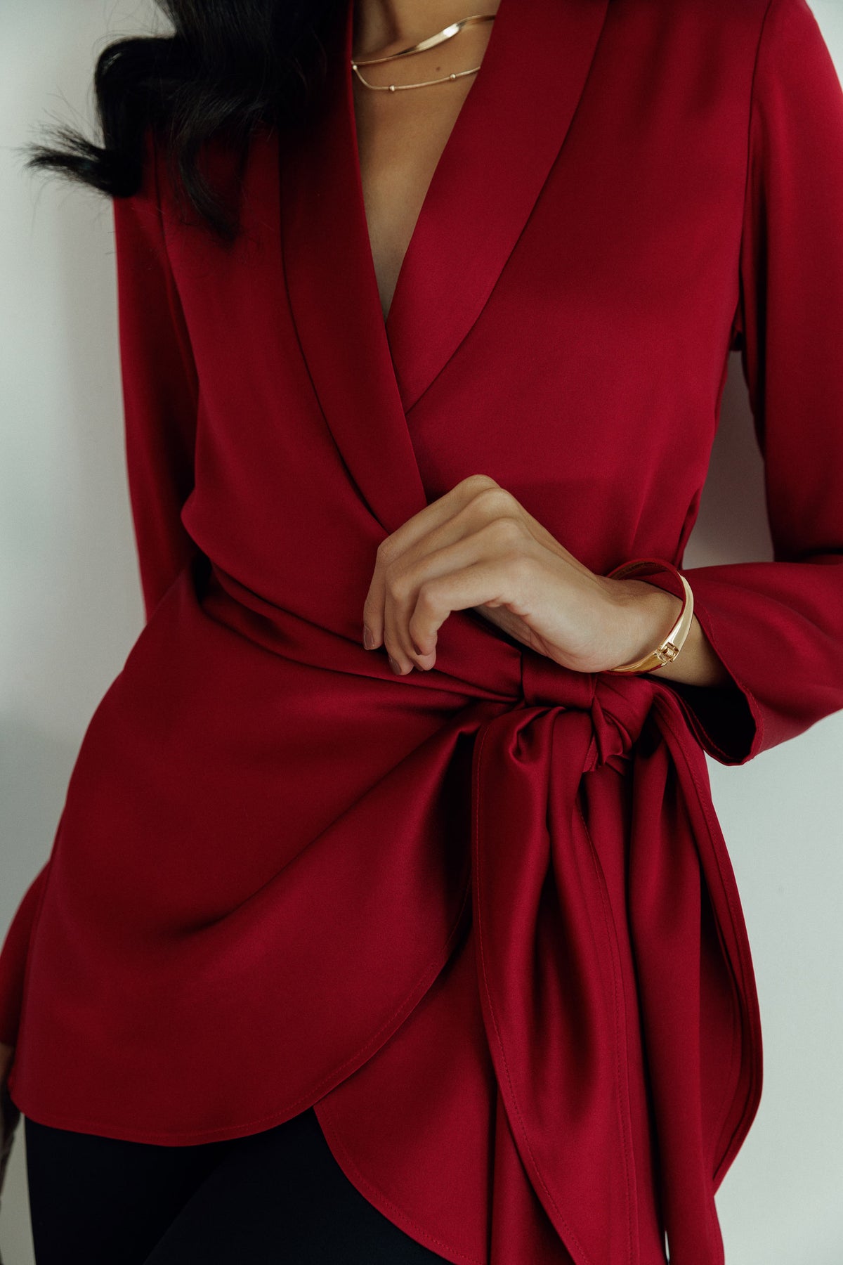 Red wrap front blazer with statement waist tie