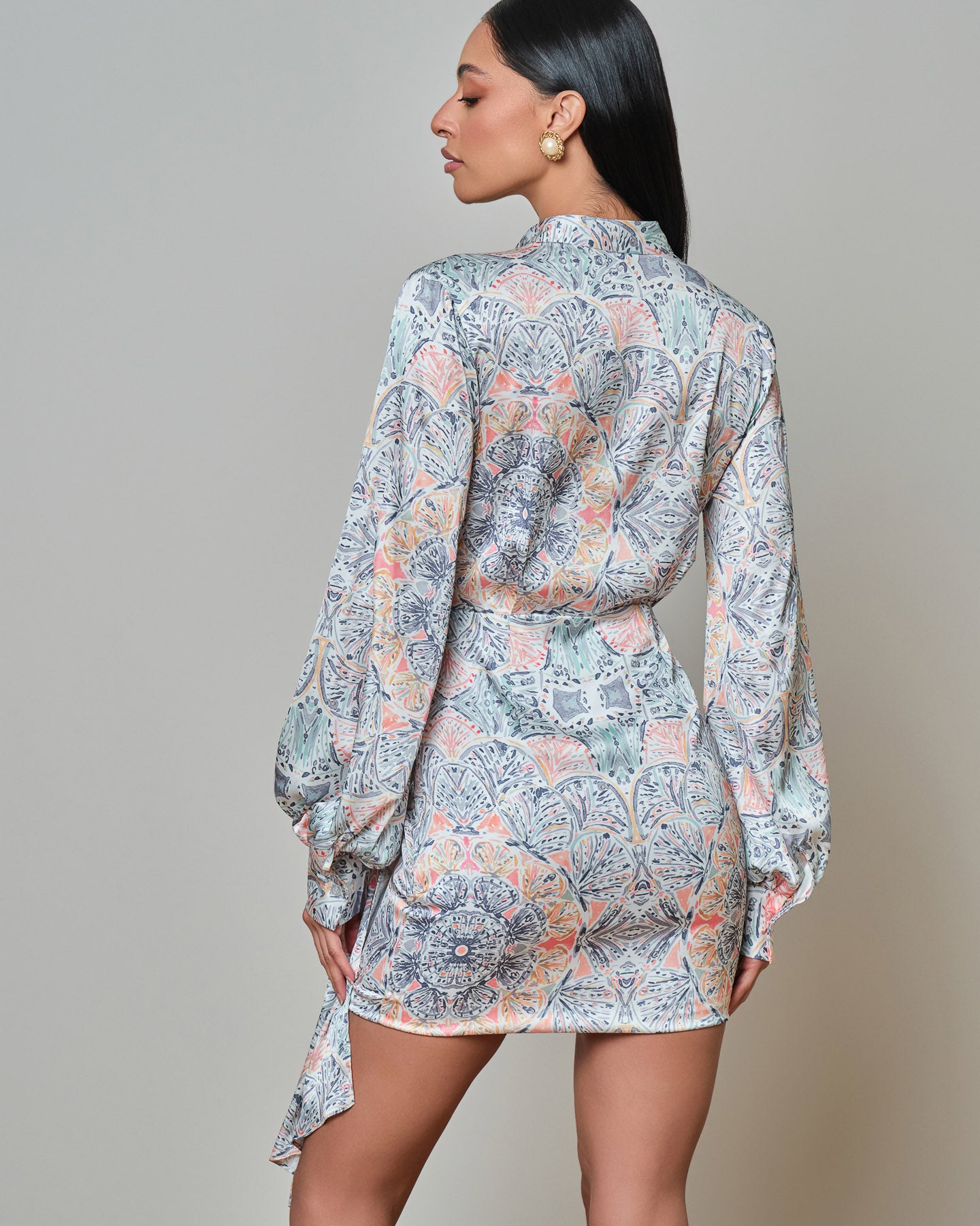 Elegant satin floral wrap mini dress with fluid silhouette