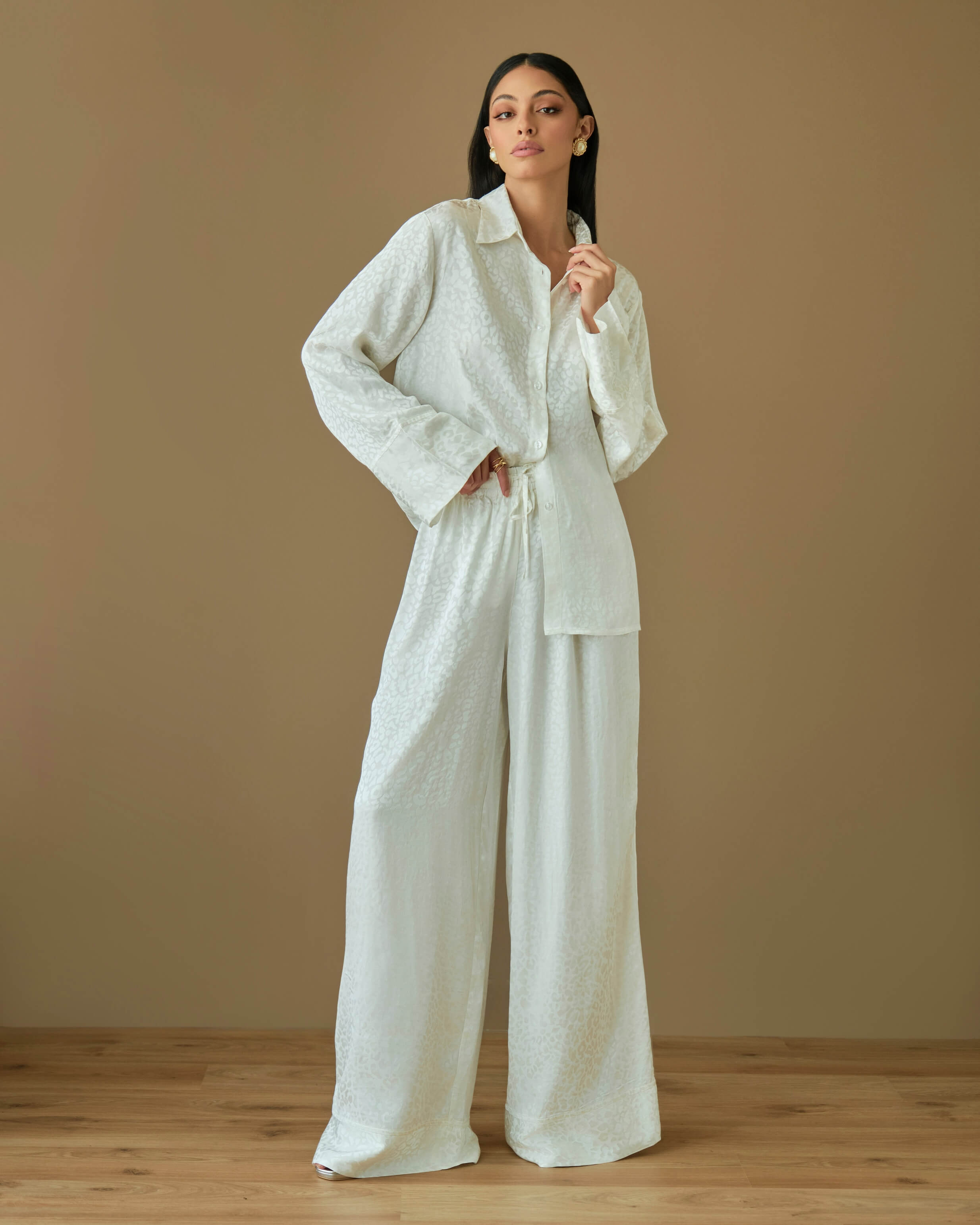 White coord set with relaxed shirt and loose fit trousers
