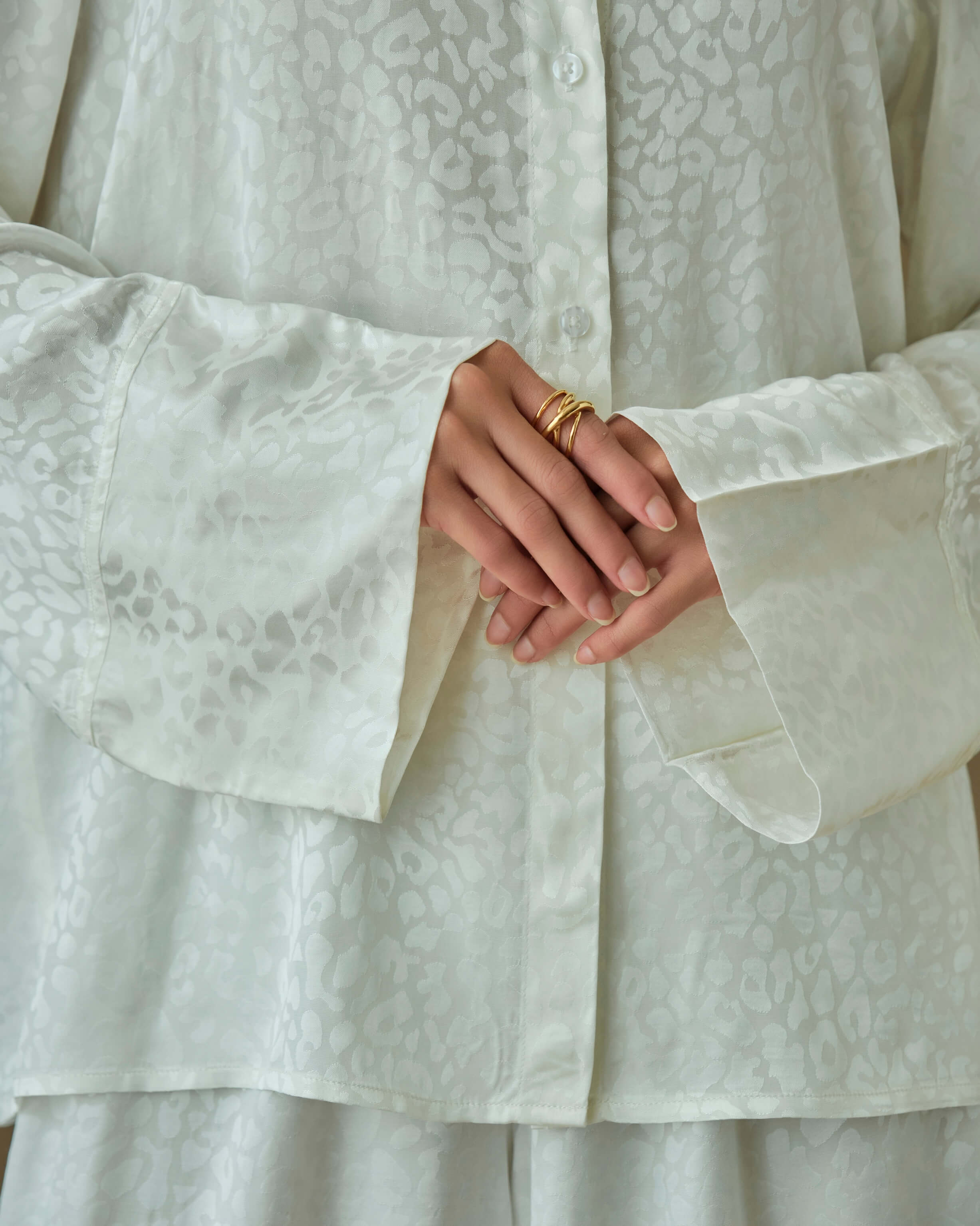 White loungewear set with shirt and wide leg pants