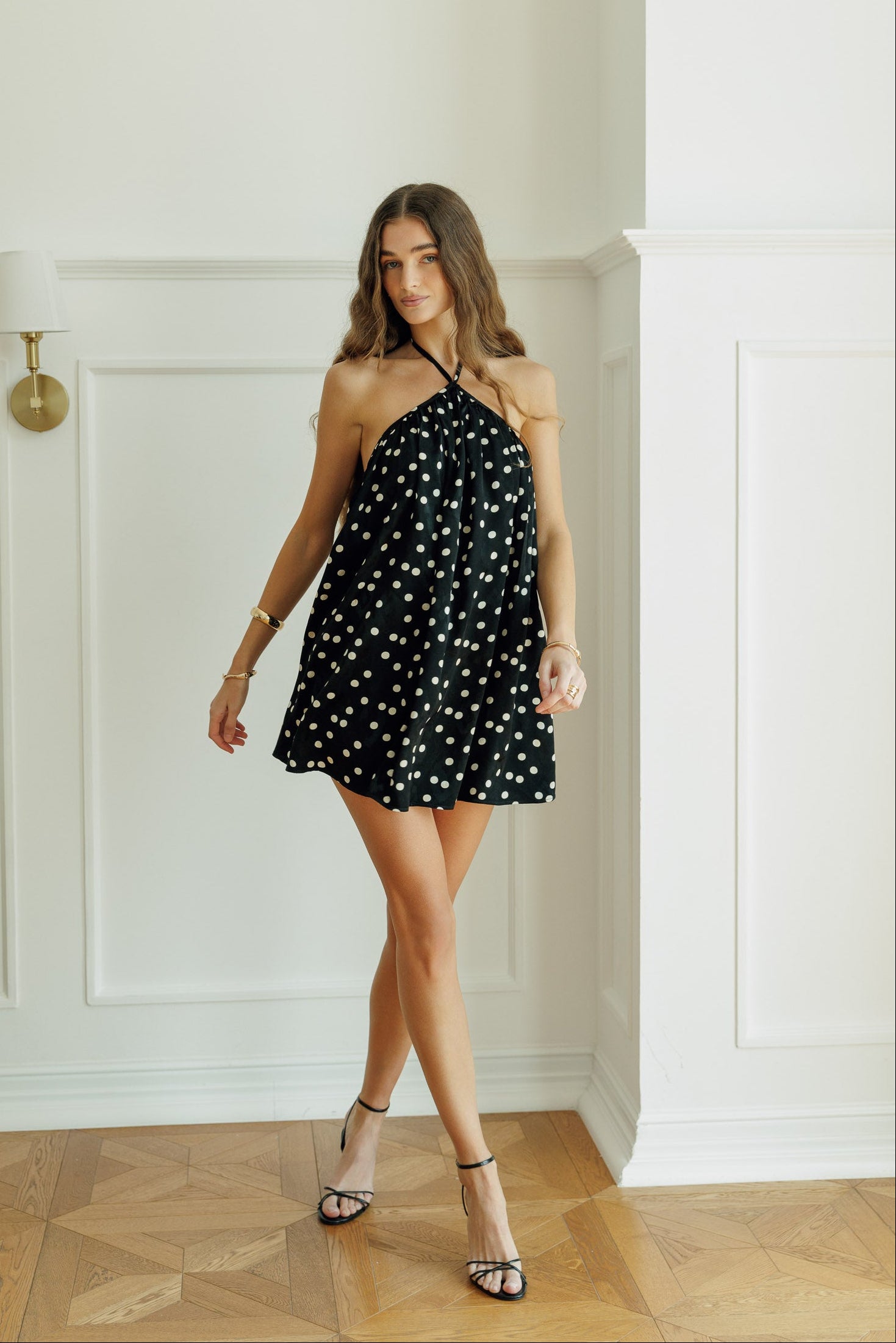 Full-length view of the Anaya black polka-dot mini dress