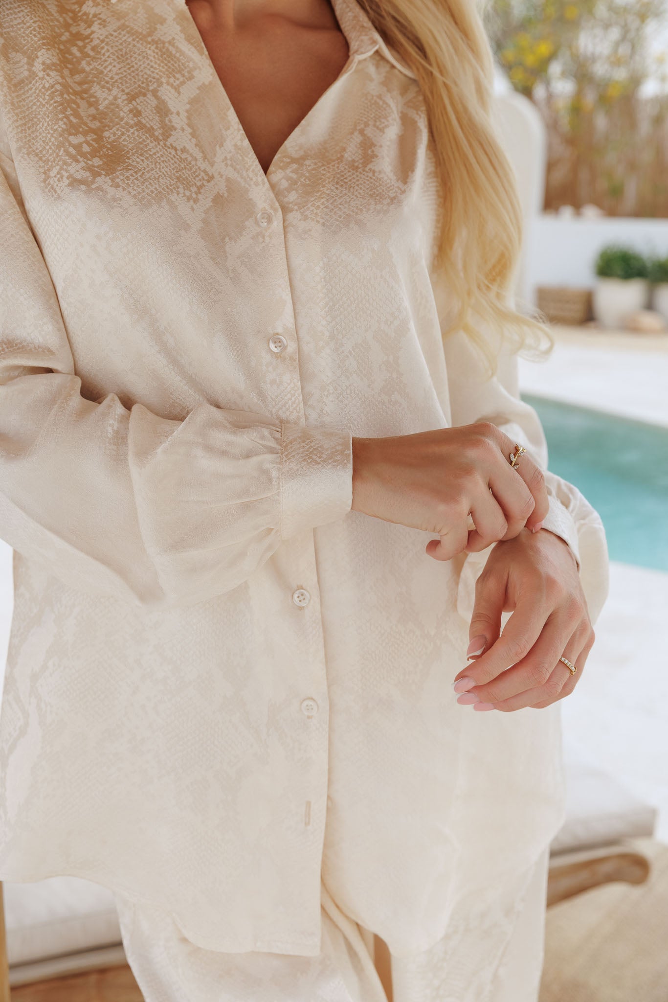 Cream matching set with button-down blouse and wide-leg pants, modern minimal style