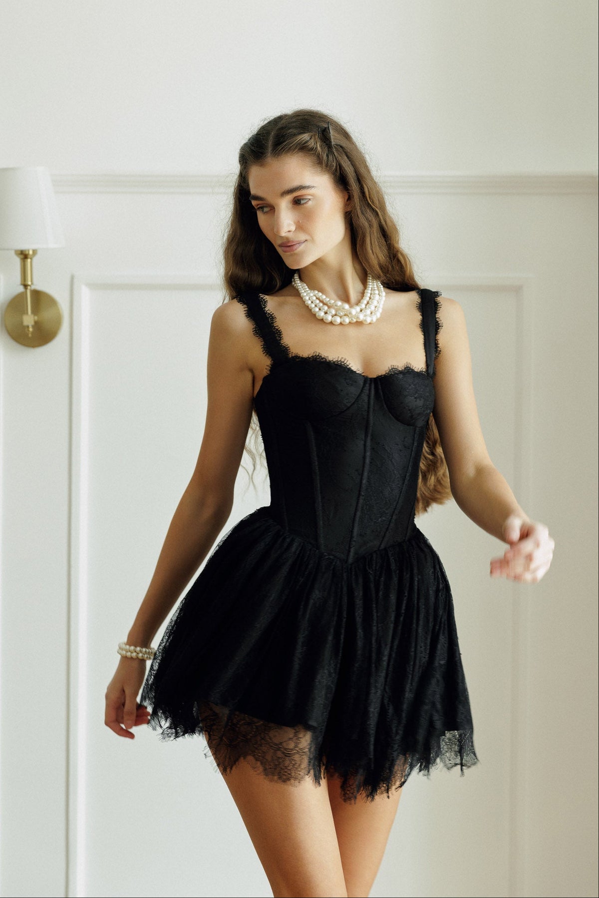 Elara Dress in black with structured corset bodice and lace skirt
