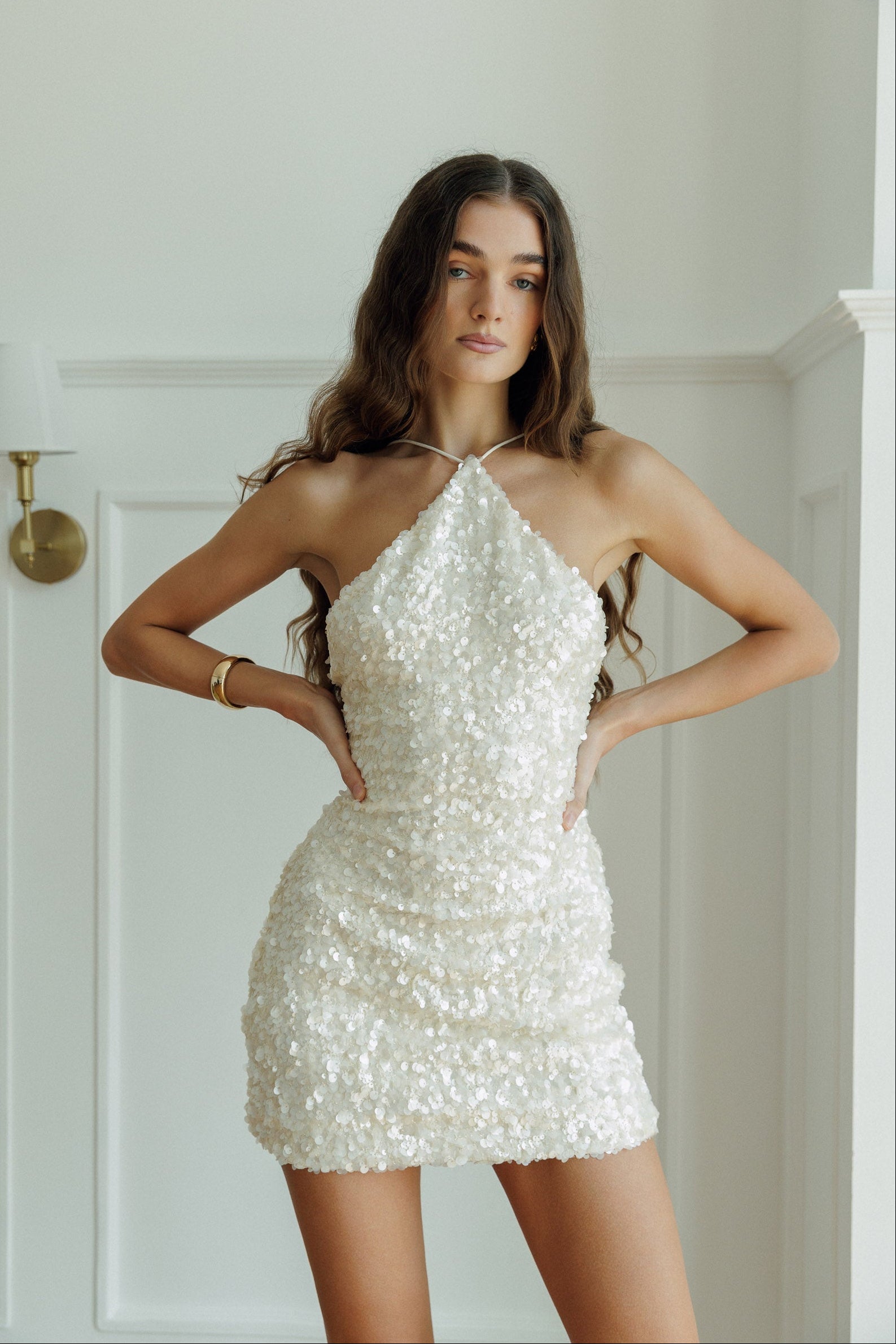 Front view of the Imogen white sequin mini dress.