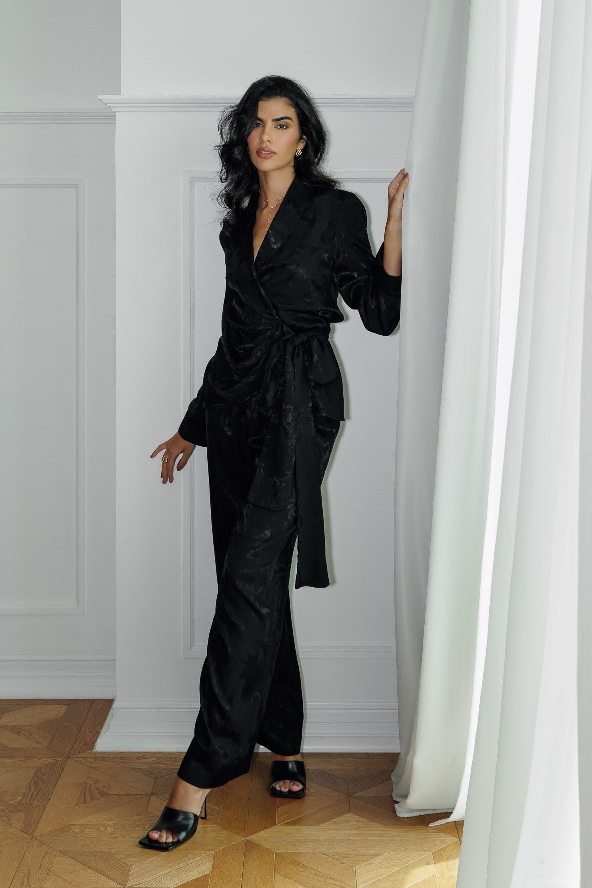 Model wearing the Lilah black blazer and matching wide-leg trousers.