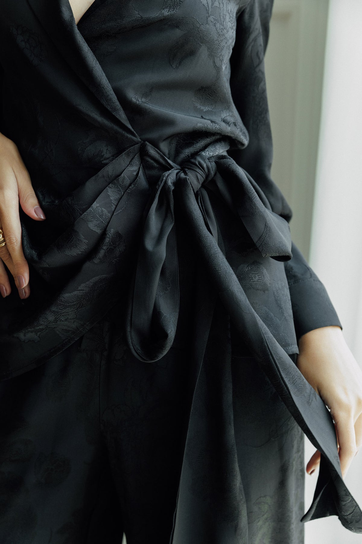 Model wearing the Lilah black blazer with matching wide-leg trousers