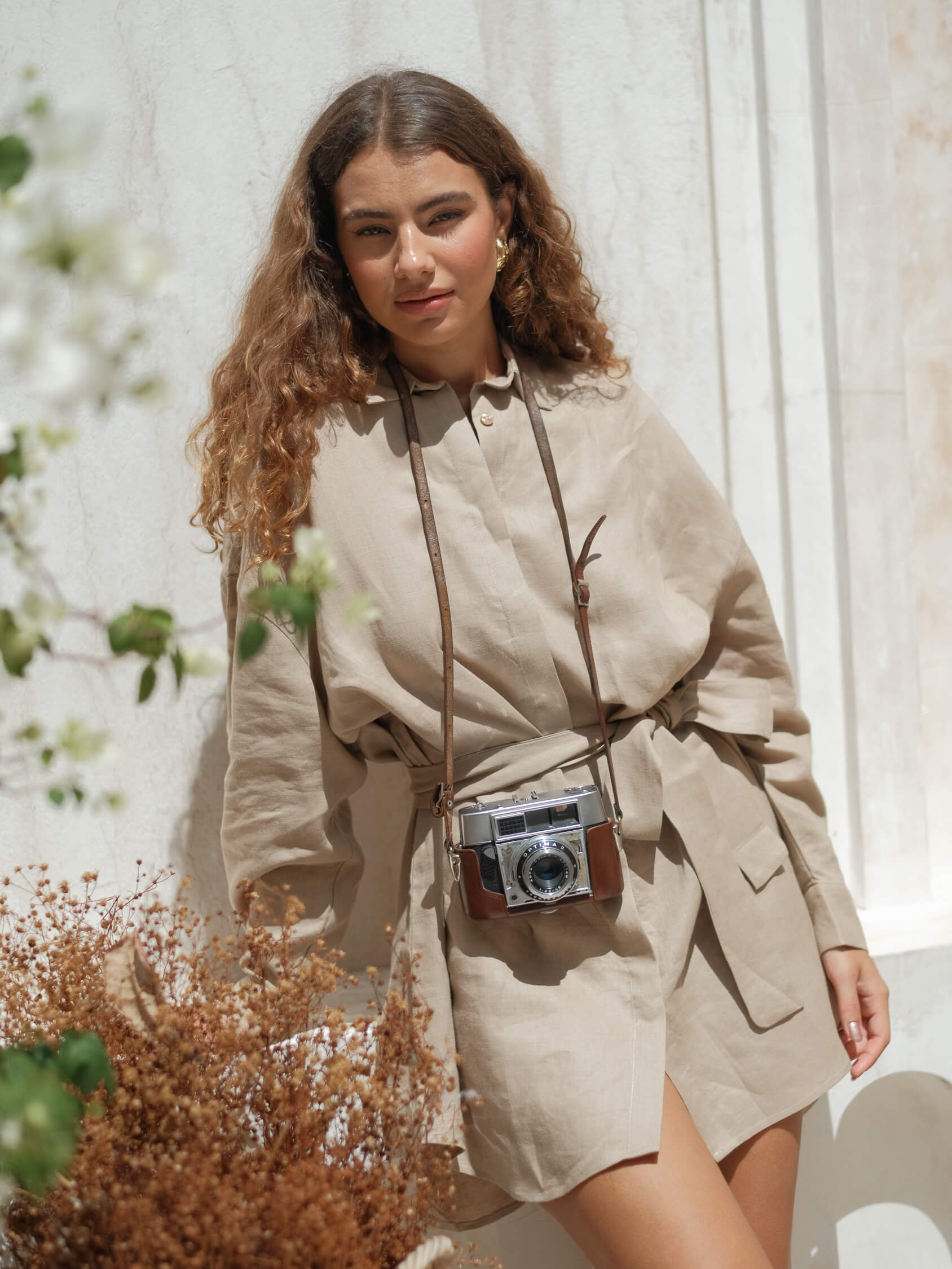 Beige linen button-up dress with long sleeves and tie waist