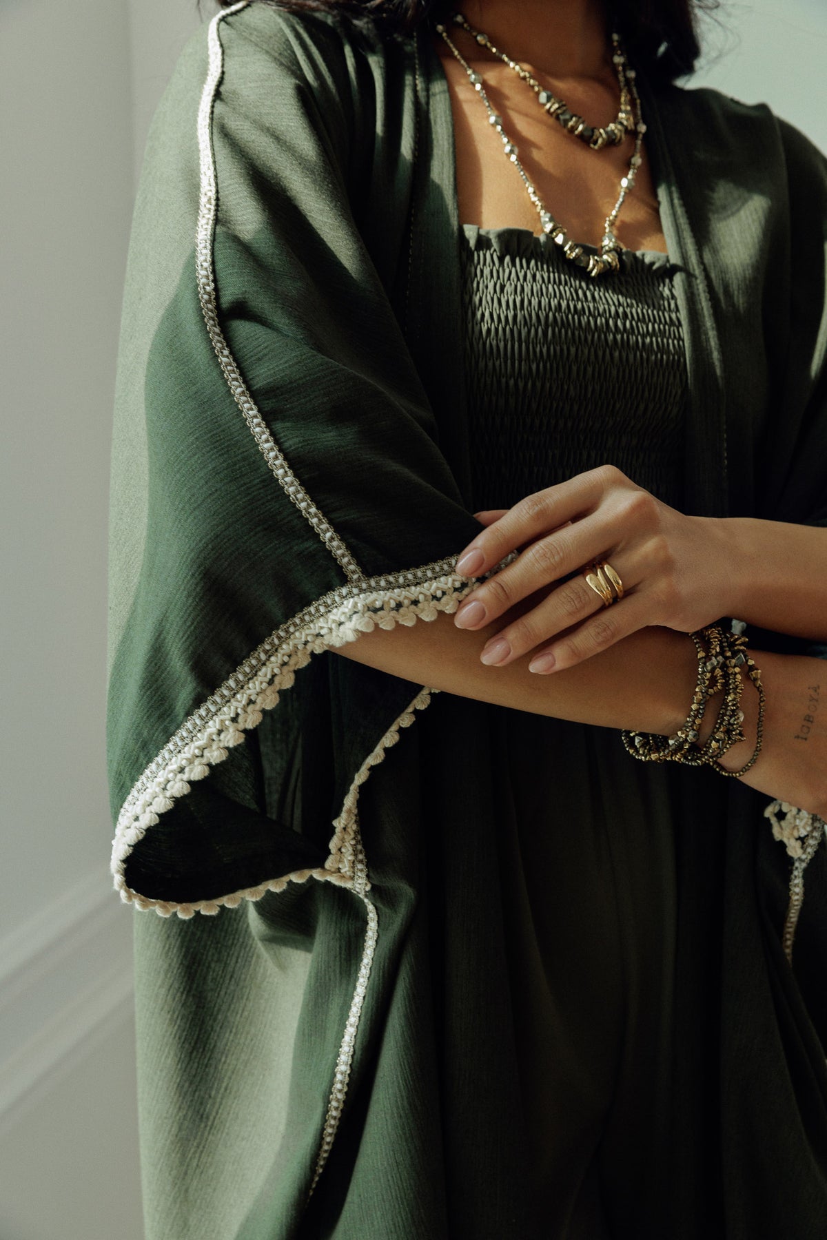 Olive green Nellie kaftan with flowing open front silhouette