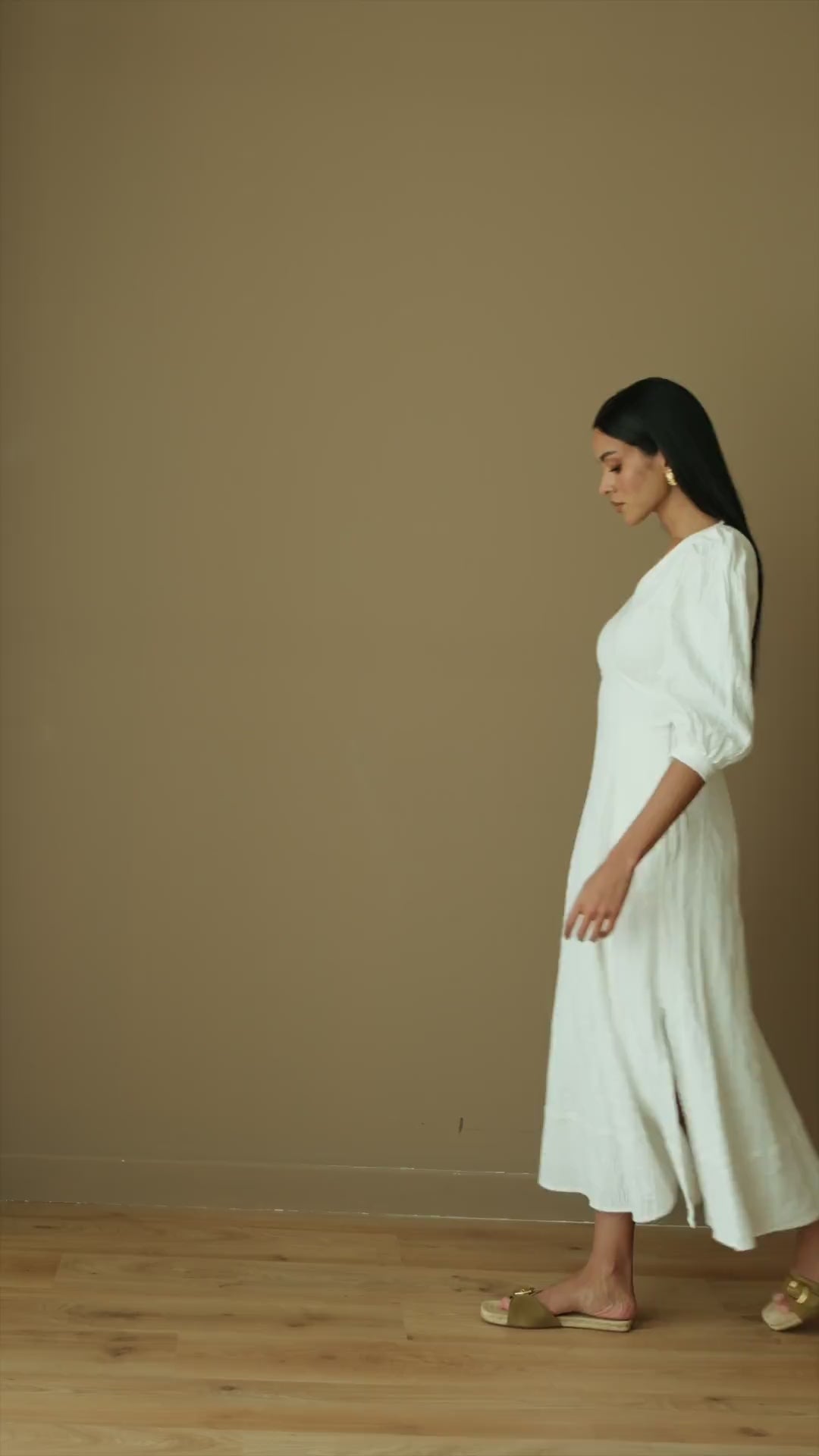Model wearing Nalla cotton dress, showcasing its open back and midi length, perfect for stylish comfort.