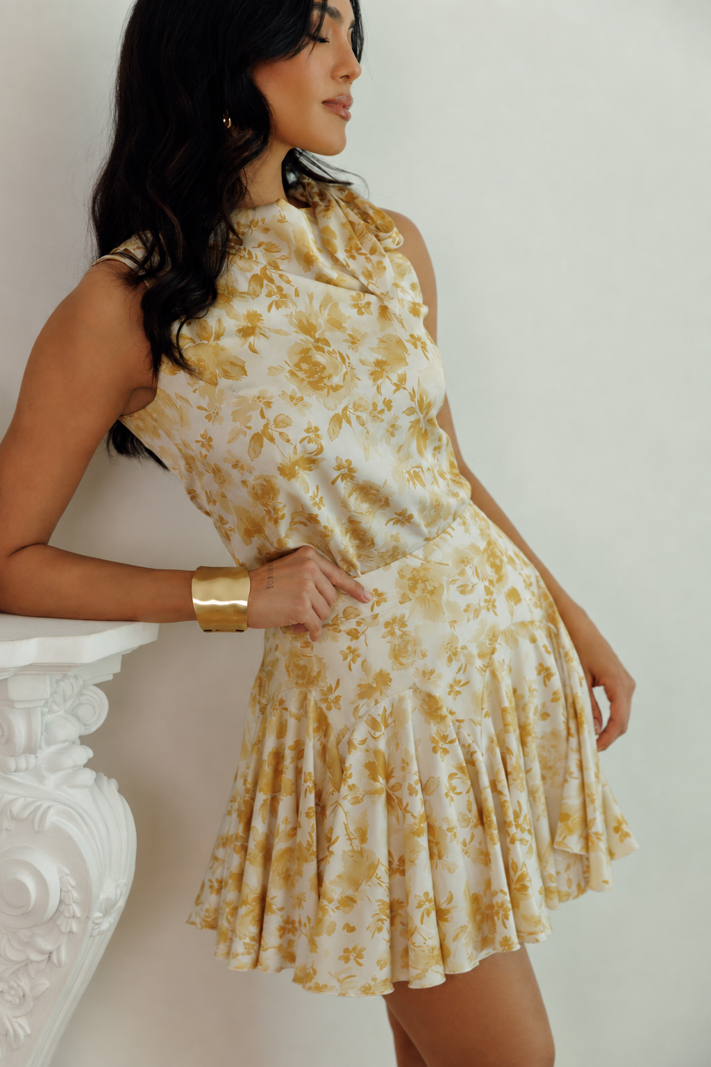 Set yellow floral sleeveless top and flared mini skirt on model