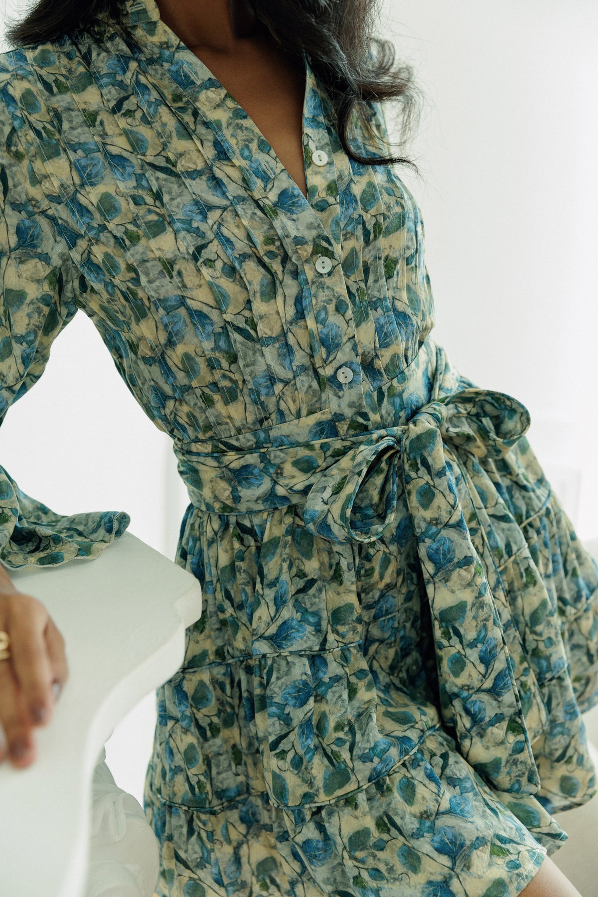 Thalia belted mini dress in green floral print with a feminine wrap silhouette.