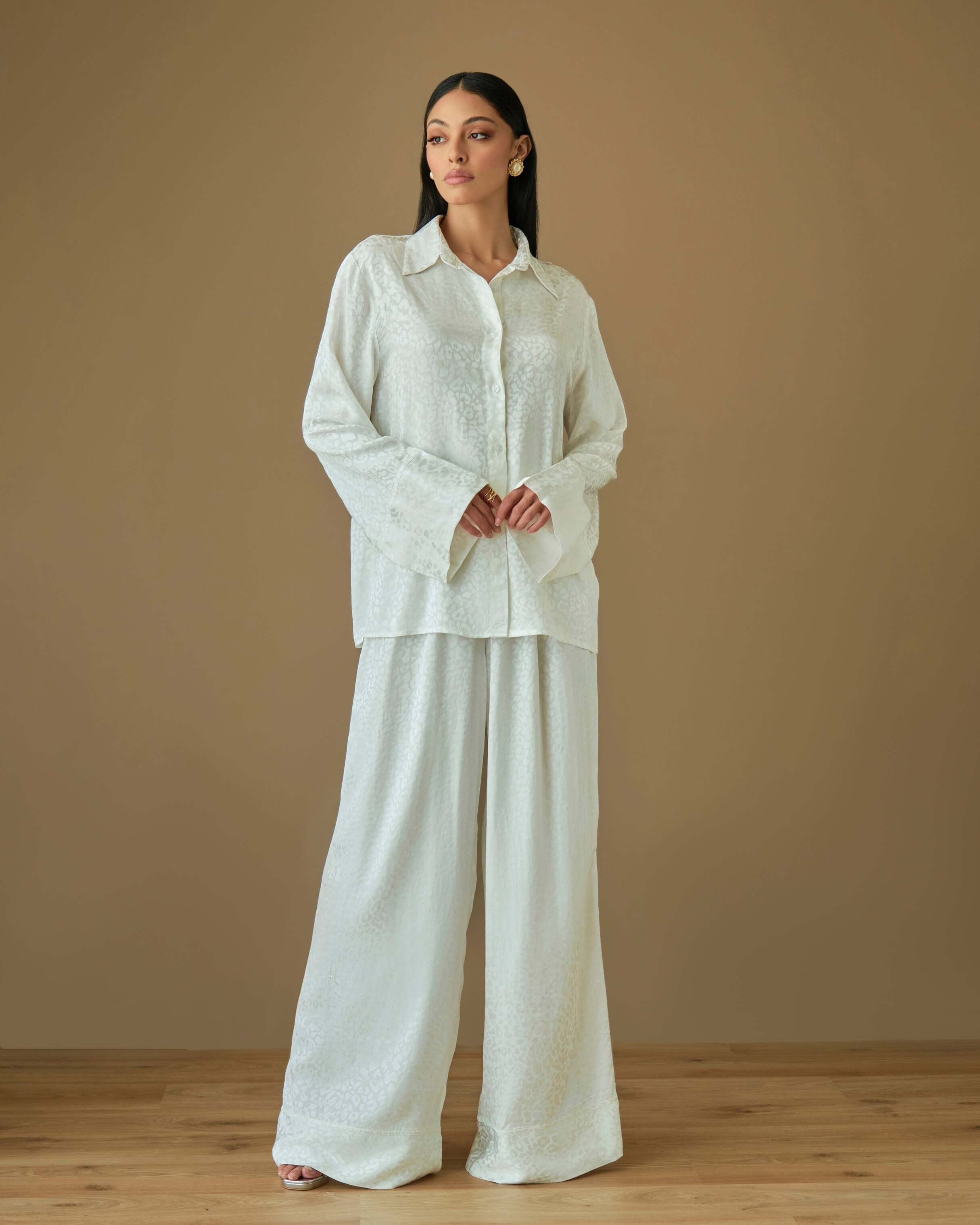 White coord set with relaxed shirt and loose fit trousers